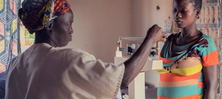 A provider weighs a pregnant woman in the Central African Republic.